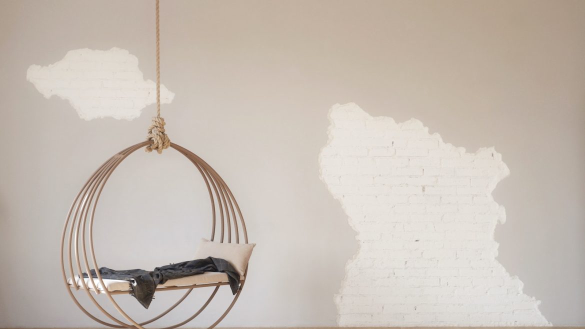 A interior swing with rustic wall