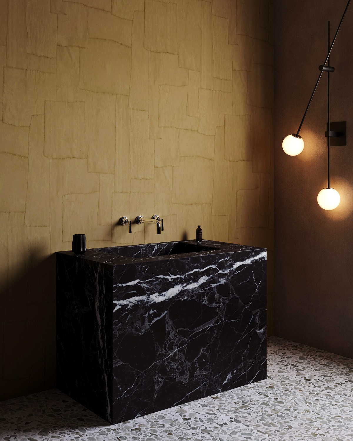 ochre arte wallcovering with black marble surfaces in a bathroom design