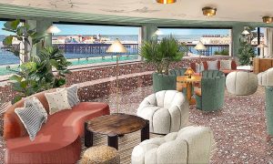 glass fronted seating area in Soho House Brighton with sea views
