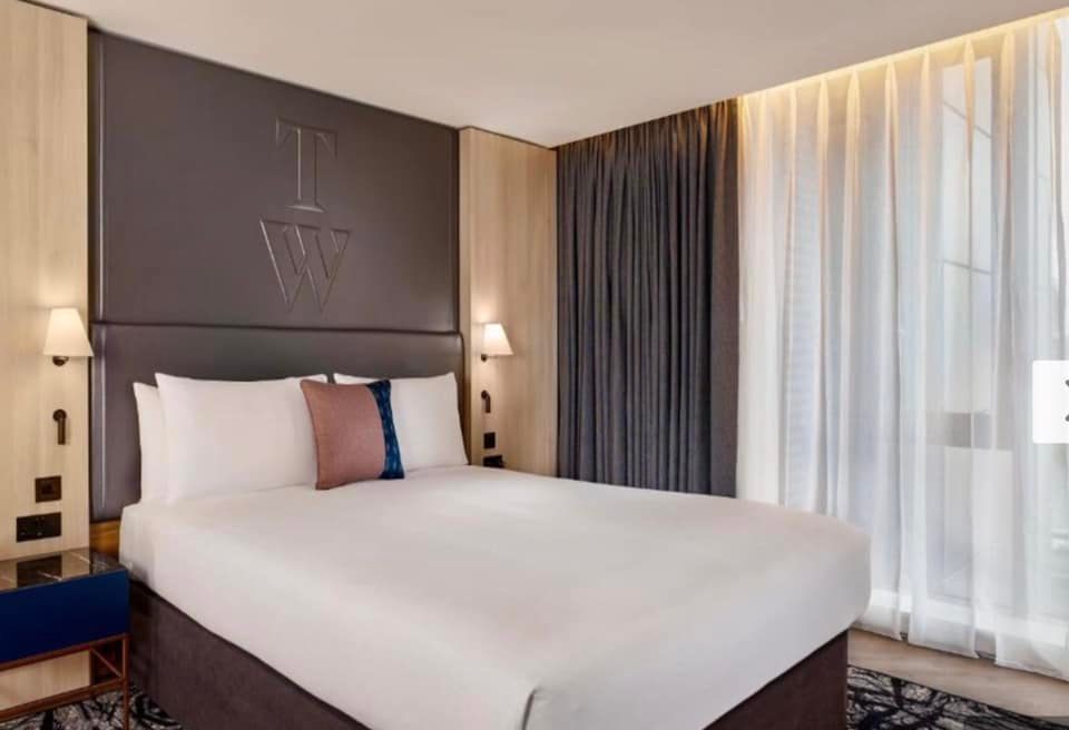 A standard bed inside hotel