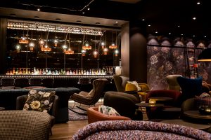 The bar and lounge at Motel One Manchester, St Peter's Square references the design of the local library
