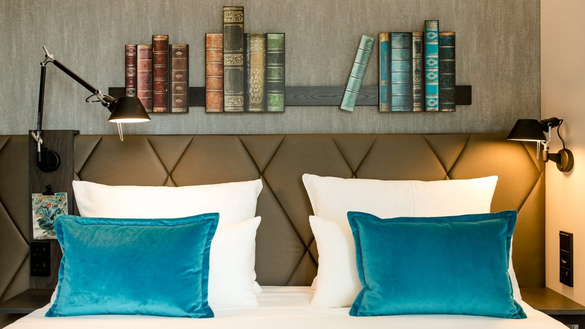 Motel One Manchester St Peters Square guestroom with books