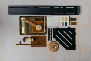 moodboard of brass and matte black for the bathroom