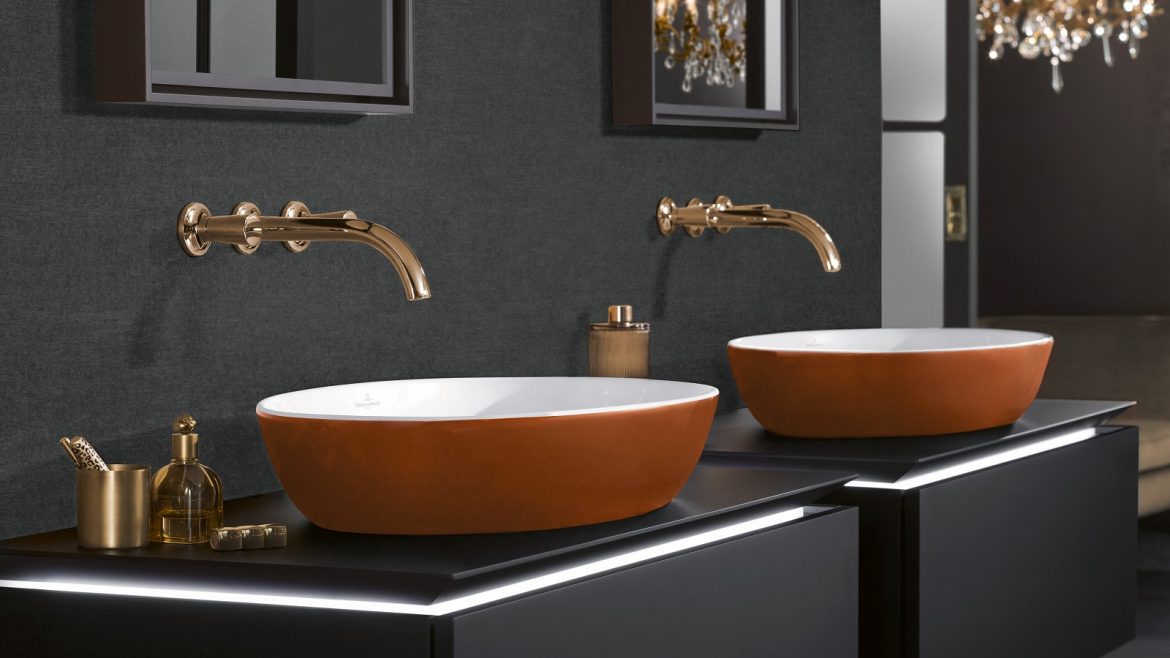 Villeroy & Boch burnt orange handbasin against black surface in the bathroom