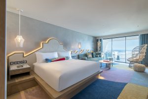 W Algarve guestroom with colourblocked carpet and contemporary design