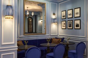a corner in the restaurant in The Twenty Two in shades of blue with reflective mirror