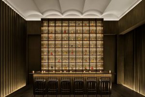 vaulted ceiling and dramatic gold and black interior design at the Gold Bar Tokyo EDITION