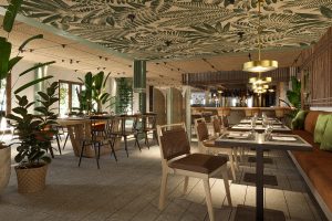 restaurant in kimpton mallorca with plants, wooden surfaces and leaf design on the ceiling