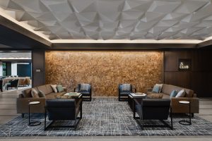 pyramid shaped ceiling tiles and woodblock feature walls in the lobby at knoxville marriott