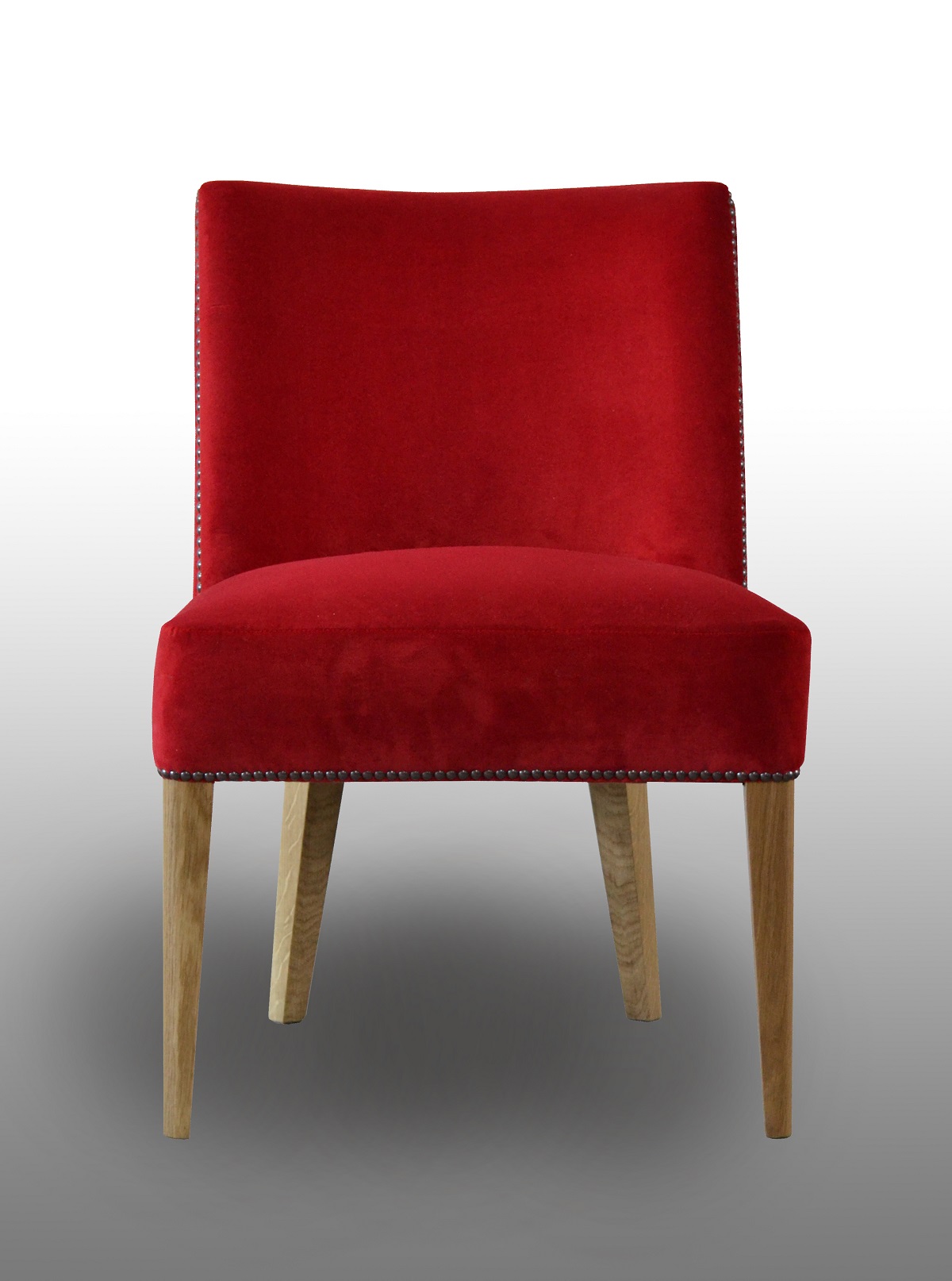 Red Lambert chair with wooden legs seen from the front