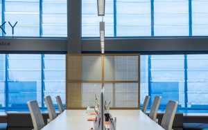 Communal work space with natural light and focus lighting by LEDS C4 designed lighting to optimise flexible working solutions in LOOM Barcelona