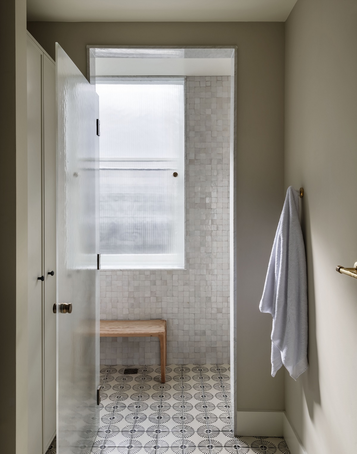 Bathroom in The Pinch with patterned floor tiles and grey zellige on the walls