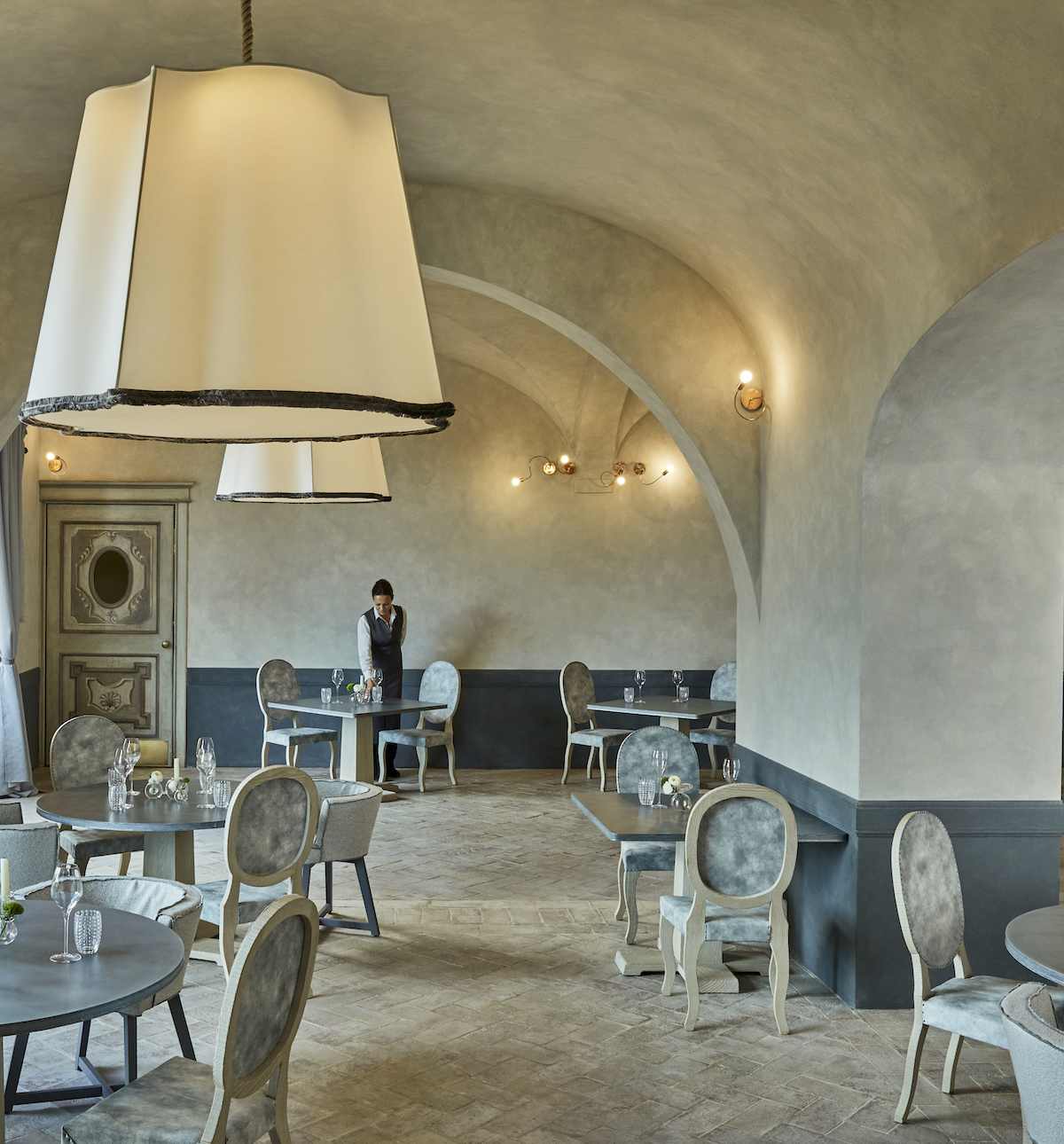 La Torre features lampshade-like chandeliers and an earthy design