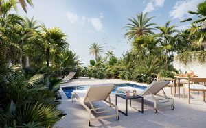sunloungers and a private pool at a guest chalet at Al Marjan