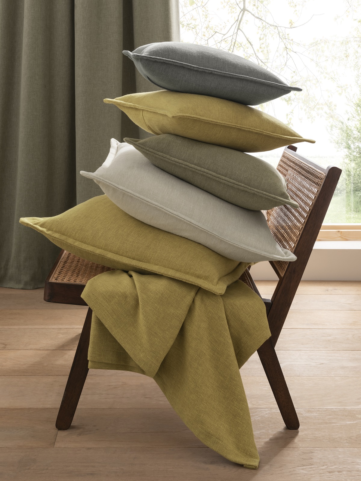 cushions in Orla fabric in natural shades of green