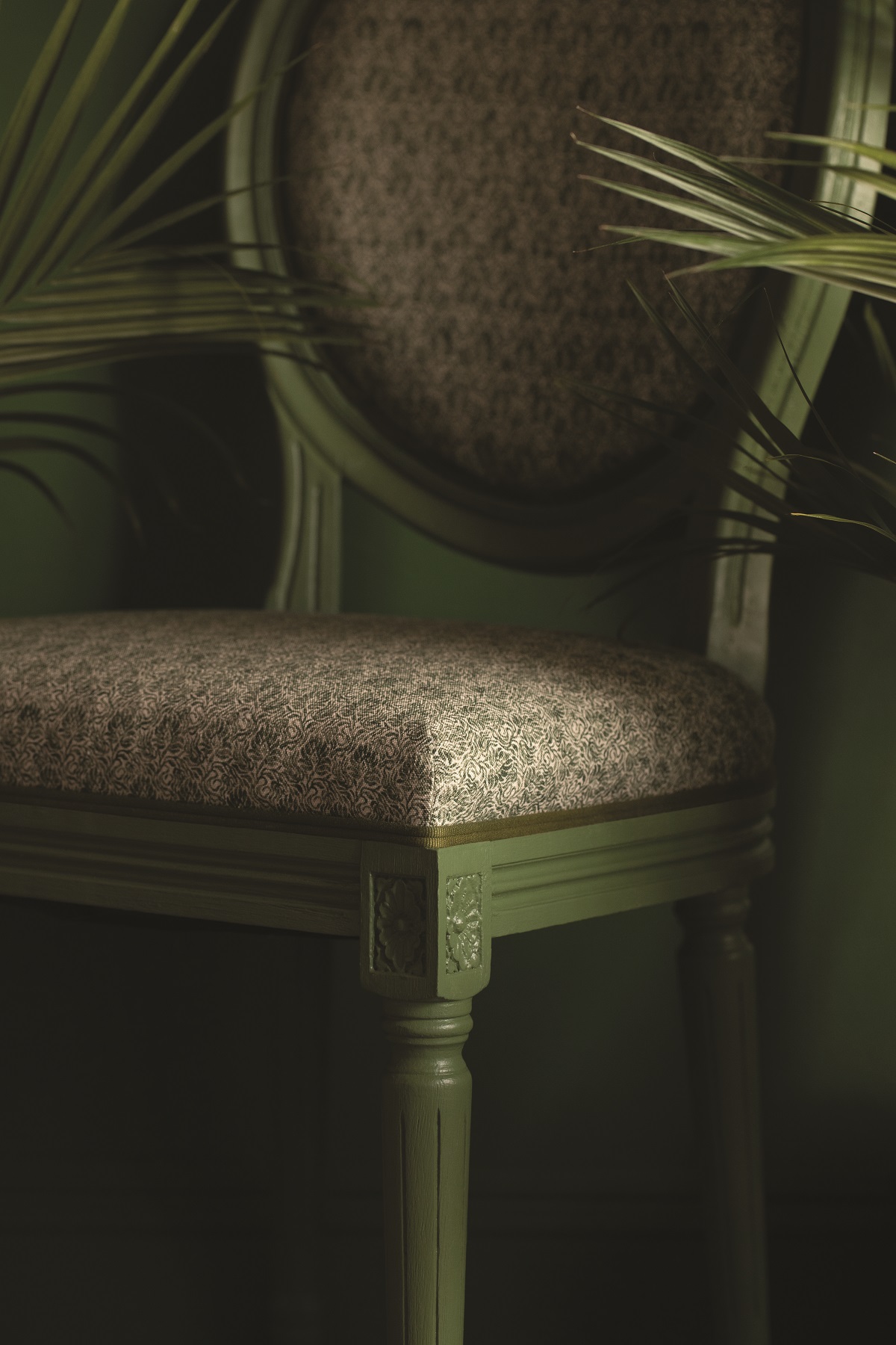 moss green chair with trimmed edges in green