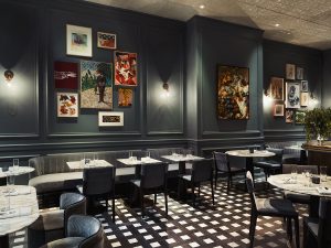 black and white check flooring and dark walls in restaurant area of Park Lane New York