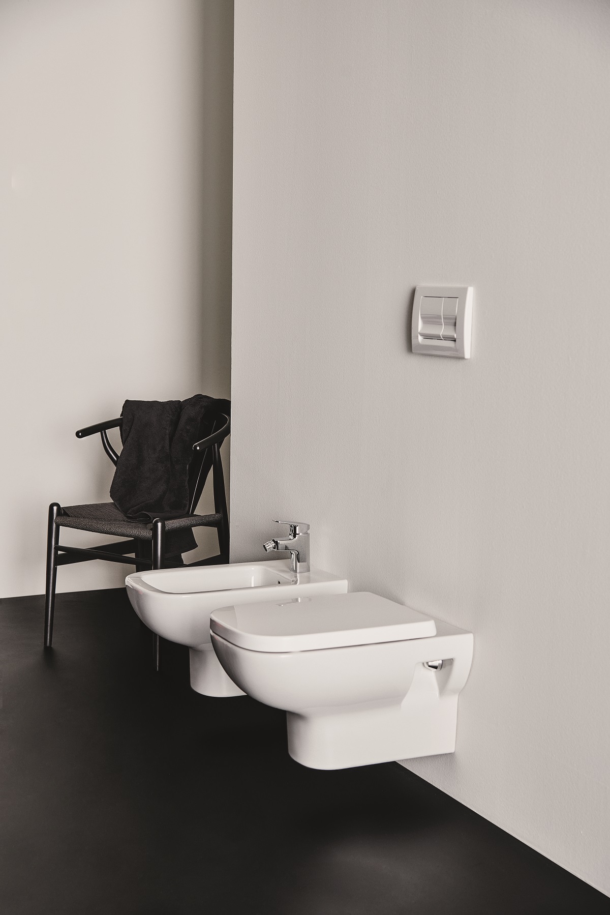 black and white bathroom with wallhung toilets by Ideal Standard