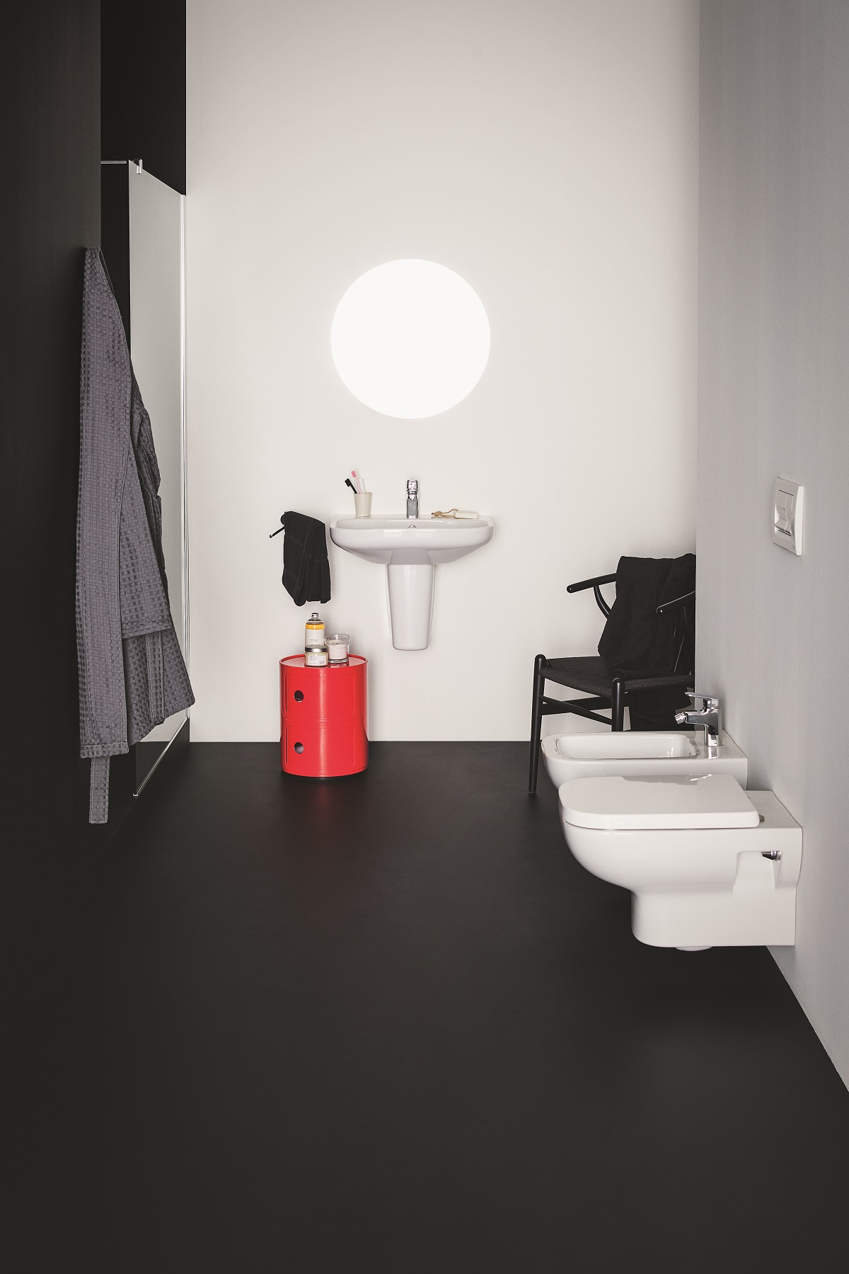 black and white bathroom with red accent and designs by i.life