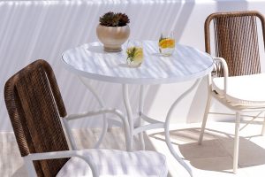 white and wicker in the dappled shade at Cosme, Paros, Greece