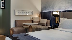 guestroom at The Morrow with seating and focussed lighting
