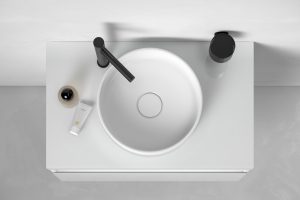 white washbasin with black taps by KEUCO