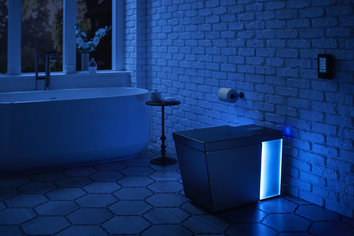 Blue-lit room with Numi 2.0 Intelligent Toilet 