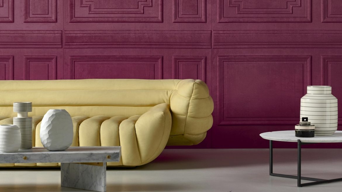 Objet wallcovering by Arte in purple contrasts with yellow sofa