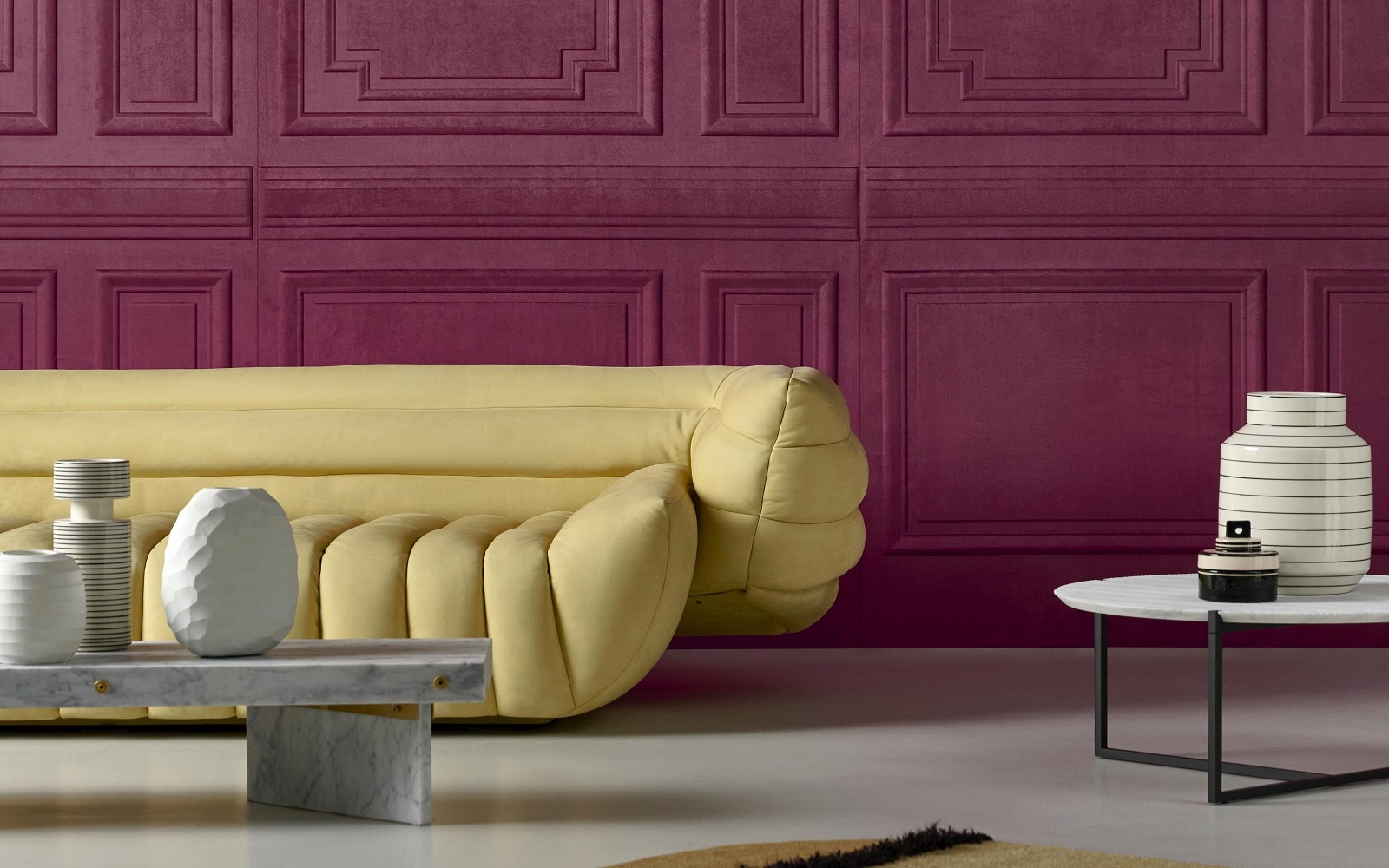 Objet wallcovering by Arte in purple contrasts with yellow sofa