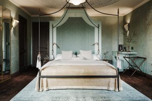 dramatic four poster bed in guestroom of Nordelaia in Piedmont Italy