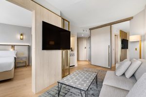 connected family guestrooms with seperate seating and tv in Hilton Galatzo Mallorca