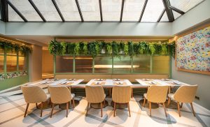 CTD tiles in the hotel restaurant with natural textures and green accents