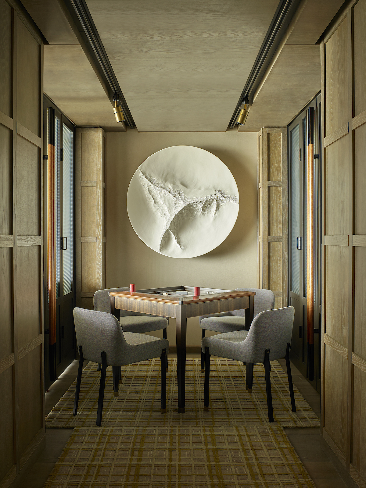An asian-inspired circular wall art in lounge