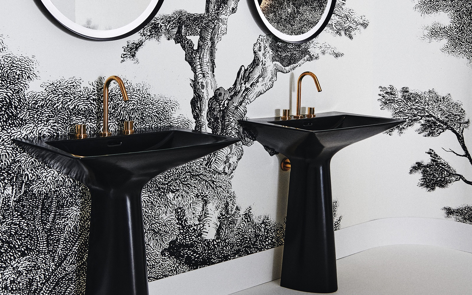 black basin with gold taps by Ideal Standard against a monochromatic wall design in the bathroom
