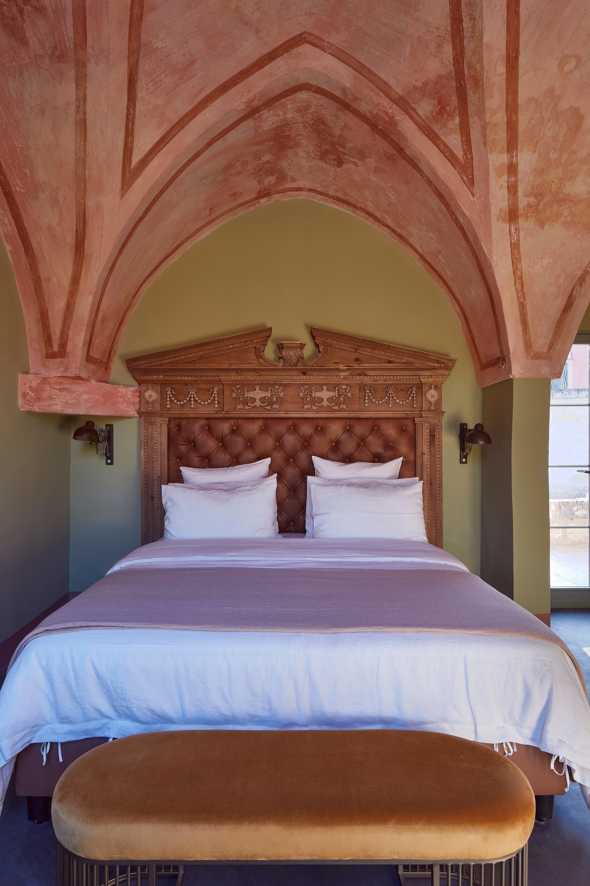 the vaulted ceilings in the guestroom in the restored masseria at tower elvira