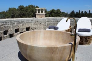 handcarved sandstone bath on the top roof terrace of Tower Elvira
