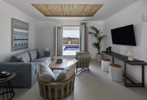 guestroom with doors to private pool at Sea Breeze Santorini Beach Resort, Curio Collection by Hilton, 