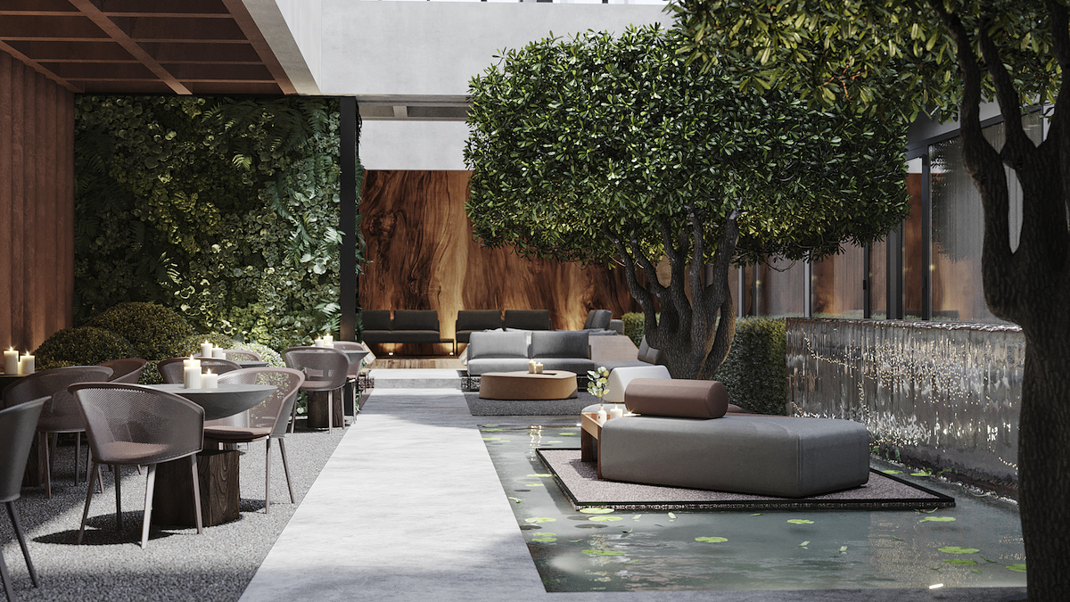 The courtyard that features living walls, and island and a water feature