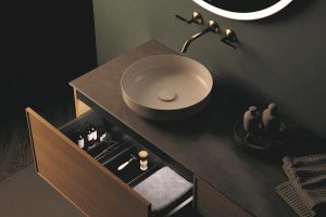 a green bathroom with the natural finishes of the alape arkta furniture range