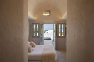 guestroom in natural materials of Santorini at the Danae Suites Santorini
