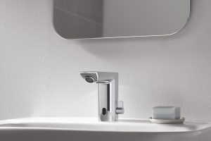 GROHE sensor activated tap mounted on white washbasin