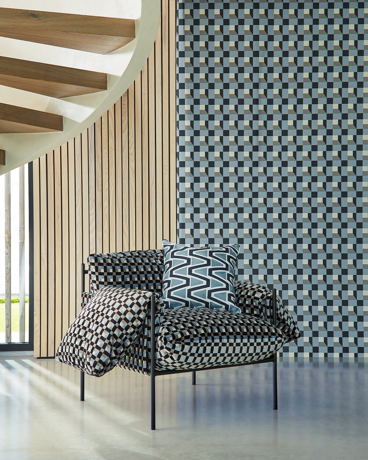 wall under staircase covered in blue Blocks design by Harlequin