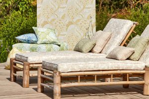 Harlequin Colours 3 Flourish styled outdoors with sunloungers and cushions