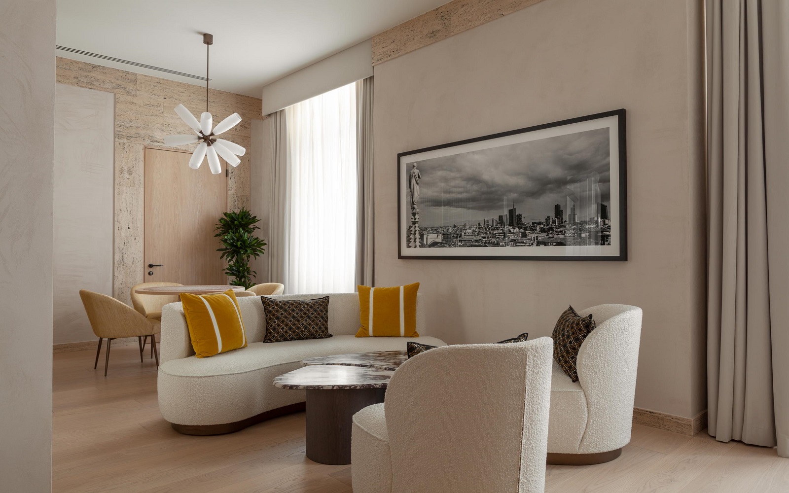 Park Hyatt Milano suite with white sofa and yellow cushions