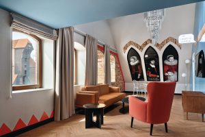 orange seating and art and design details at the Radisson RED Gdansk
