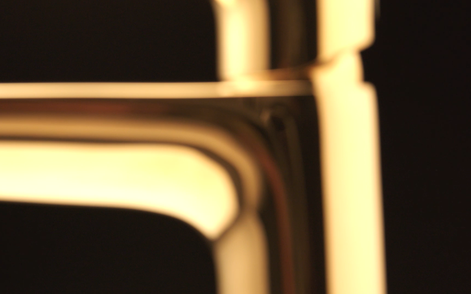 Extreme close up of Hansgrohe tap in gold