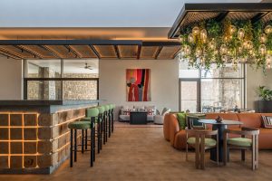 The W lounge at W Costa Navarino with bar and seating using local and natural materials