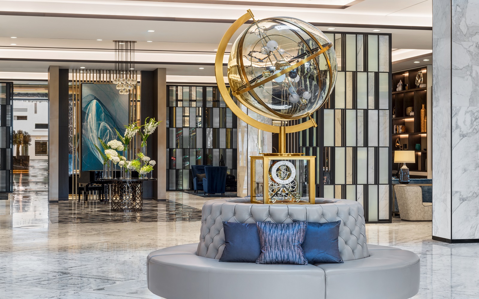 Waldorf Astoria Kuwait lobby with central sculptural clock feature
