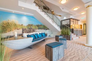 beach scene wallcovering by Newmor with boat in hotel lobby