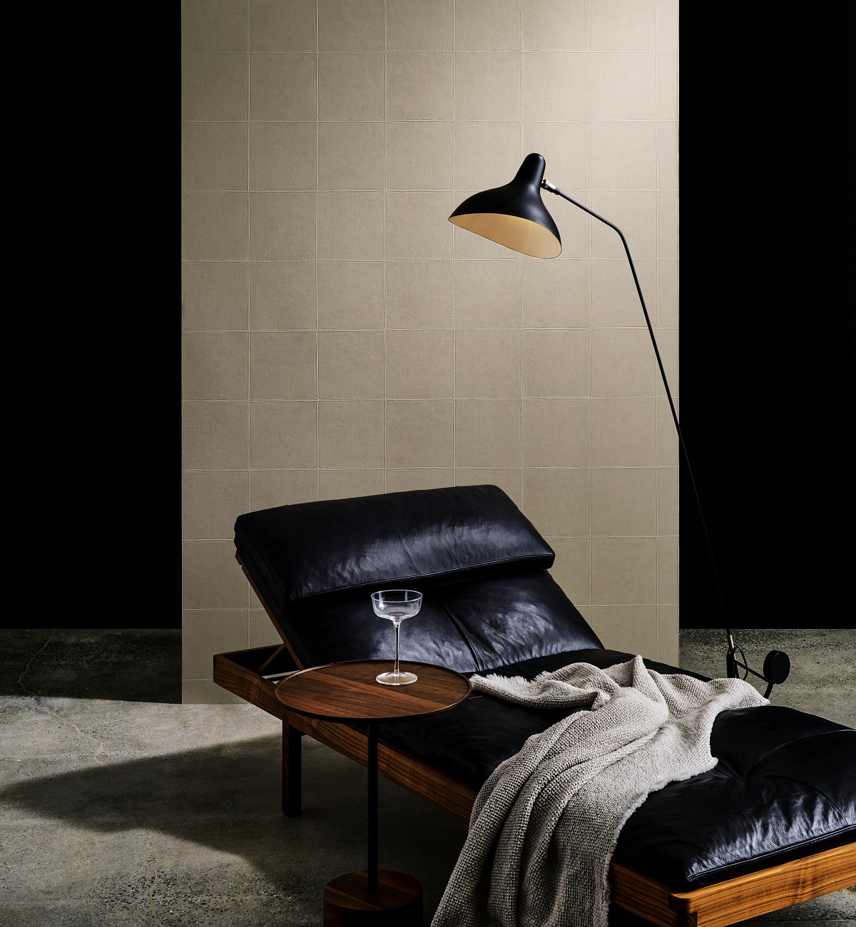black leather chair and lamp with Arte Textura Campo